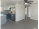 Modern kitchen with stainless steel appliances, gray cabinets, and a stylish backsplash, perfect for cooking at 4803 Guardian Ave, Holiday, FL 34690