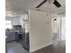 Remodeled kitchen featuring stainless steel appliances, gray and white cabinets and decorative backsplash at 4803 Guardian Ave, Holiday, FL 34690