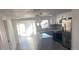 Contemporary kitchen with a center island, stainless steel refrigerator, and modern pendant lighting fixtures at 4803 Guardian Ave, Holiday, FL 34690