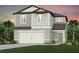 Charming two-story home featuring a two car garage, landscaped yard, and a welcoming front door at 6674 Michael Favor Way, Wesley Chapel, FL 33545