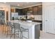 Well-equipped kitchen featuring an island with seating, stainless steel appliances, and ample cabinet space at 6674 Michael Favor Way, Wesley Chapel, FL 33545