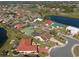 Aerial view of a residential neighborhood featuring waterfront properties and serene landscaping at 701 Westmont Way, Sun City Center, FL 33573
