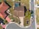 Overhead view of a home featuring tile roof, screened pool and lush landscaping at 701 Westmont Way, Sun City Center, FL 33573