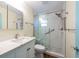 Updated bathroom with glass shower and modern vanity at 701 Westmont Way, Sun City Center, FL 33573