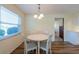 Cozy breakfast nook with natural light and updated flooring; ideal for relaxed dining at 701 Westmont Way, Sun City Center, FL 33573