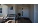 Cozy front porch featuring a 'Welcome' bench and tile flooring at 701 Westmont Way, Sun City Center, FL 33573