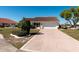 Charming single-story home with well-maintained landscaping and a spacious driveway at 701 Westmont Way, Sun City Center, FL 33573