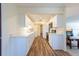 Modern kitchen with stainless steel appliances, updated cabinets and countertops, and wood flooring at 701 Westmont Way, Sun City Center, FL 33573