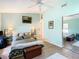 Light teal bedroom with hardwood floors and a comfortable bed at 8403 Wakulla Dr, Temple Terrace, FL 33637