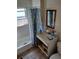 Bathroom with shower/tub combo, vanity, and patterned curtain at 1868 Mississippi Ne Ave, St Petersburg, FL 33703