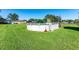 Above ground pool with ladder in a grassy backyard at 36941 Blanton Rd, Dade City, FL 33523