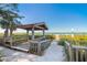 Beachfront gazebo with benches, offering convenient and scenic beach access at 1279 Mohawk Rd, Venice, FL 34293