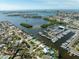 Aerial view of waterfront home and marina in the background at 1301 Sea Gull S Dr, St Petersburg, FL 33707