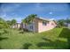 Pink house with double doors and mature landscaping at 1301 Sea Gull S Dr, St Petersburg, FL 33707