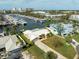 Aerial view of waterfront home with boat slips and marina in background at 1301 Sea Gull S Dr, St Petersburg, FL 33707