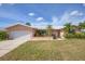 Single story home with attached garage and landscaped yard at 1301 Sea Gull S Dr, St Petersburg, FL 33707