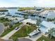 Aerial view of home on waterfront property with boat and marina at 1301 Sea Gull S Dr, St Petersburg, FL 33707