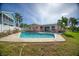 Relaxing kidney-shaped pool with a spacious patio at 1301 Sea Gull S Dr, St Petersburg, FL 33707