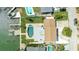 Top-down aerial view of a home, pool, and dock, set against the tranquil water backdrop at 7886 9Th S Ave, St Petersburg, FL 33707