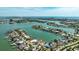 Stunning aerial view of waterfront homes with boat docks nestled in a tranquil community near the ocean at 7886 9Th S Ave, St Petersburg, FL 33707