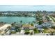 Aerial view showcases waterfront homes, lush landscaping, and private docks along the canal at 7886 9Th S Ave, St Petersburg, FL 33707