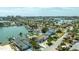 Picturesque aerial view of waterfront homes with docks and pools, surrounded by tropical landscaping at 7886 9Th S Ave, St Petersburg, FL 33707