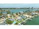 Waterfront homes showcasing a private pool and boat dock with serene water views from above at 7886 9Th S Ave, St Petersburg, FL 33707