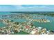 Waterfront home showcasing a private pool and boat dock with serene water views from above at 7886 9Th S Ave, St Petersburg, FL 33707