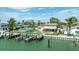 Waterfront home showcasing a private pool, backyard, boat dock, and serene water views at 7886 9Th S Ave, St Petersburg, FL 33707