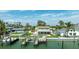 Waterfront home showcasing a private pool, backyard, boat dock, and serene water views at 7886 9Th S Ave, St Petersburg, FL 33707