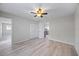 Spacious bedroom featuring ceiling fan, with doorway to kitchen and another room at 7886 9Th S Ave, St Petersburg, FL 33707