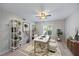 Well-lit home office with stylish decor, ceiling fan, and contemporary furnishings at 7886 9Th S Ave, St Petersburg, FL 33707