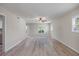 Bright living room featuring neutral paint, lots of natural light and wood-look floors at 7886 9Th S Ave, St Petersburg, FL 33707
