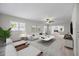 Bright living room showcasing neutral paint, stylish decor, and lots of natural light at 7886 9Th S Ave, St Petersburg, FL 33707
