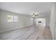 Bright living room featuring neutral paint, lots of natural light and wood-look floors at 7886 9Th S Ave, St Petersburg, FL 33707
