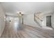 Bright and airy living room with a staircase and open floor plan to the back at 7886 9Th S Ave, St Petersburg, FL 33707
