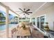 Outdoor living space boasting a covered patio with ample seating, a dining table, and views of the refreshing pool at 7886 9Th S Ave, St Petersburg, FL 33707