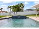 Close-up of the pool's decorative tile waterfall feature at 7886 9Th S Ave, St Petersburg, FL 33707