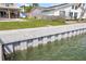 A seawall with water access with backyard views of patio and home at 7886 9Th S Ave, St Petersburg, FL 33707