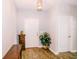 Bright entryway featuring wood-look floors, fresh paint and decorative lighting at 802 Highgate Oaks Pl, Seffner, FL 33584