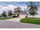 A cozy single-story home featuring a manicured lawn and an attached two-car garage at 802 Highgate Oaks Pl, Seffner, FL 33584