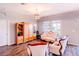 Inviting living room with wood-look floors, neutral walls, and bright, natural light at 802 Highgate Oaks Pl, Seffner, FL 33584