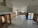 Damaged kitchen with exposed framing and subflooring at 1301 Sea Gull S Dr, St Petersburg, FL 33707