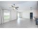 Spacious living room with tile floors and sliding doors at 14906 Imperial Purple Ln, Wimauma, FL 33598
