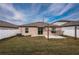 Spacious backyard with grassy area and privacy fence at 14906 Imperial Purple Ln, Wimauma, FL 33598