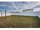 Large backyard with grassy area and privacy fence at 14906 Imperial Purple Ln, Wimauma, FL 33598