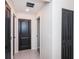 Clean hallway with tile flooring and neutral walls at 14906 Imperial Purple Ln, Wimauma, FL 33598