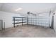 Garage with overhead storage shelving at 14906 Imperial Purple Ln, Wimauma, FL 33598