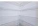 Walk-in pantry with wire shelving at 14906 Imperial Purple Ln, Wimauma, FL 33598
