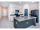 Modern kitchen with granite counters and island at 14906 Imperial Purple Ln, Wimauma, FL 33598